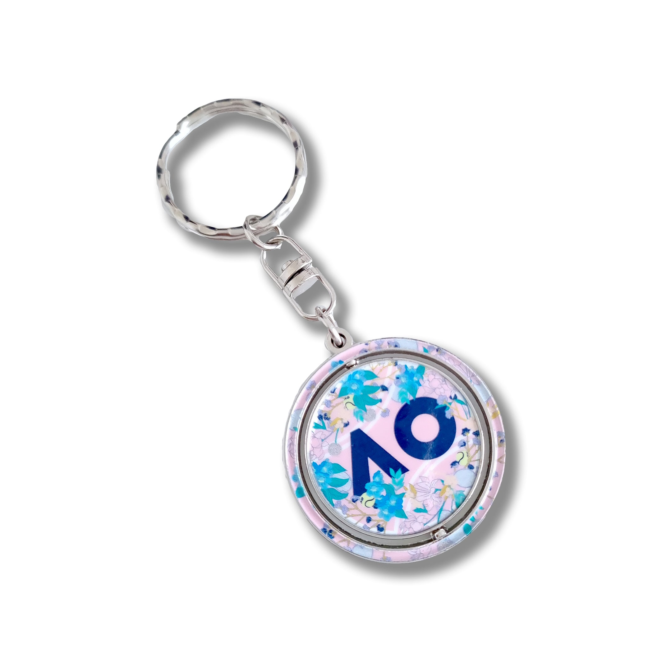 AO Logo Flower Keyring featuring a floral print design, the iconic AO logo, and a spinning disc silhouette with a split keyring attachment and silver chain.