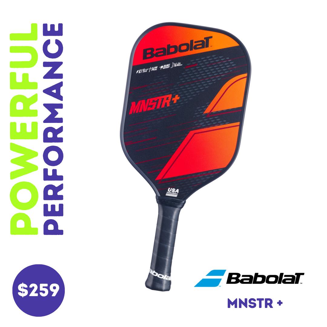Close-up view of the Babolat MNSTR+ paddle, showing the face with orange, red and black graphics against a white background.