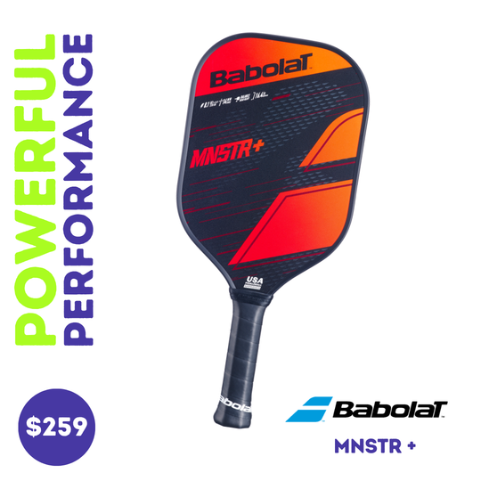 Close-up view of the Babolat MNSTR+ paddle, showing the face with orange, red and black graphics against a white background.