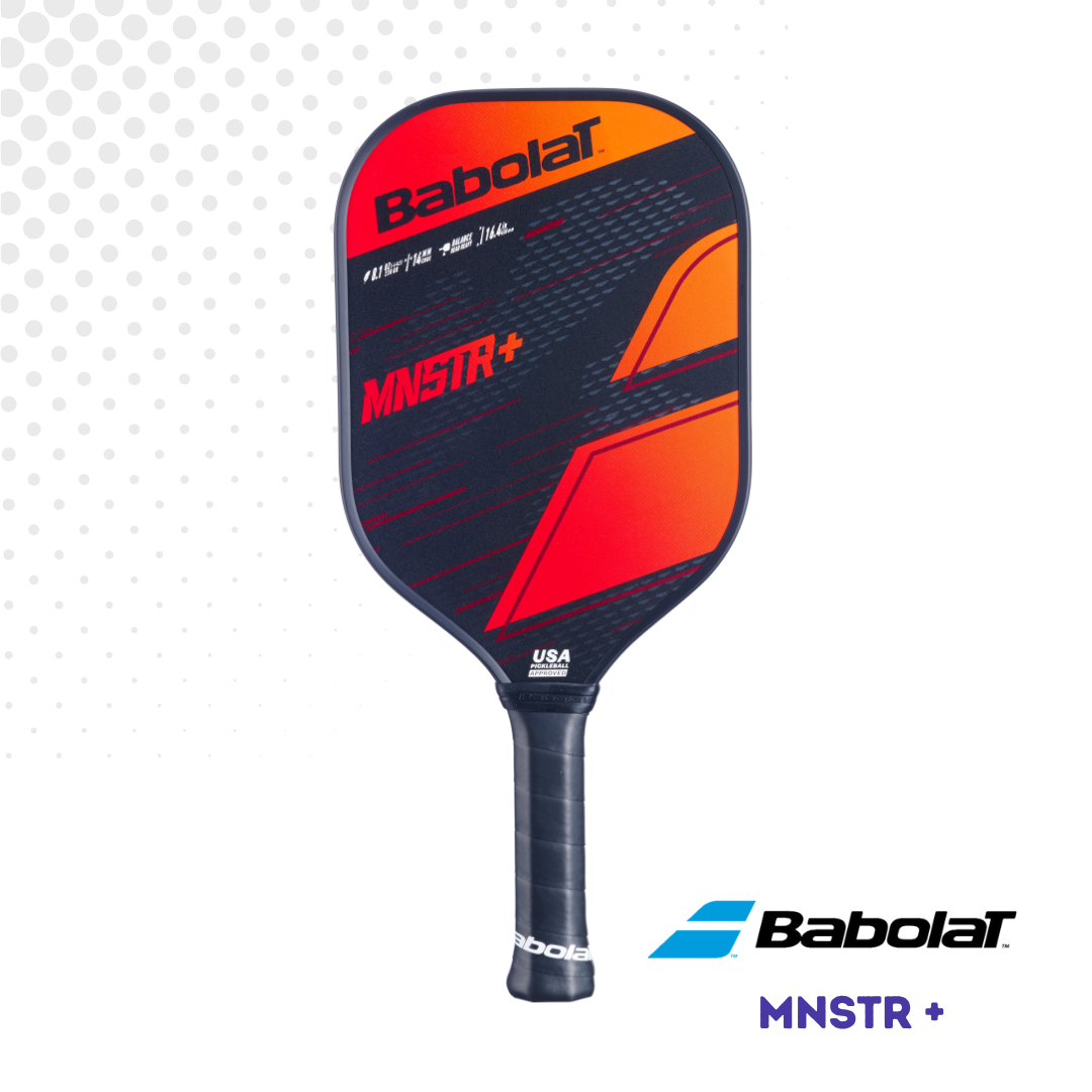 Front view of the Babolat MNSTR+ paddle, showing the face with orange, red and black graphics against a white background.